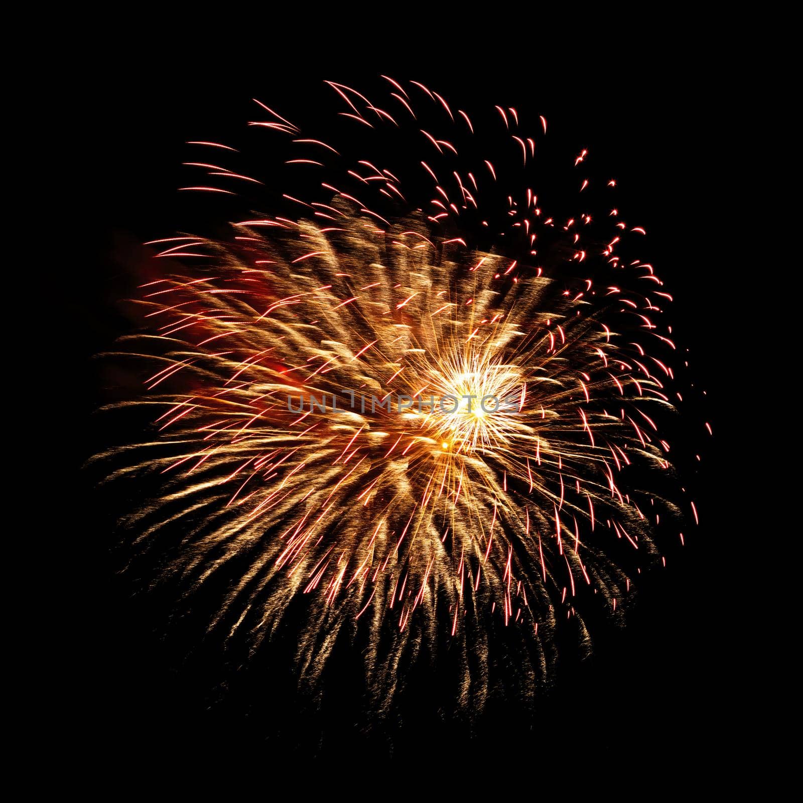 Colorful celebration fireworks isolated on a black sky background.
