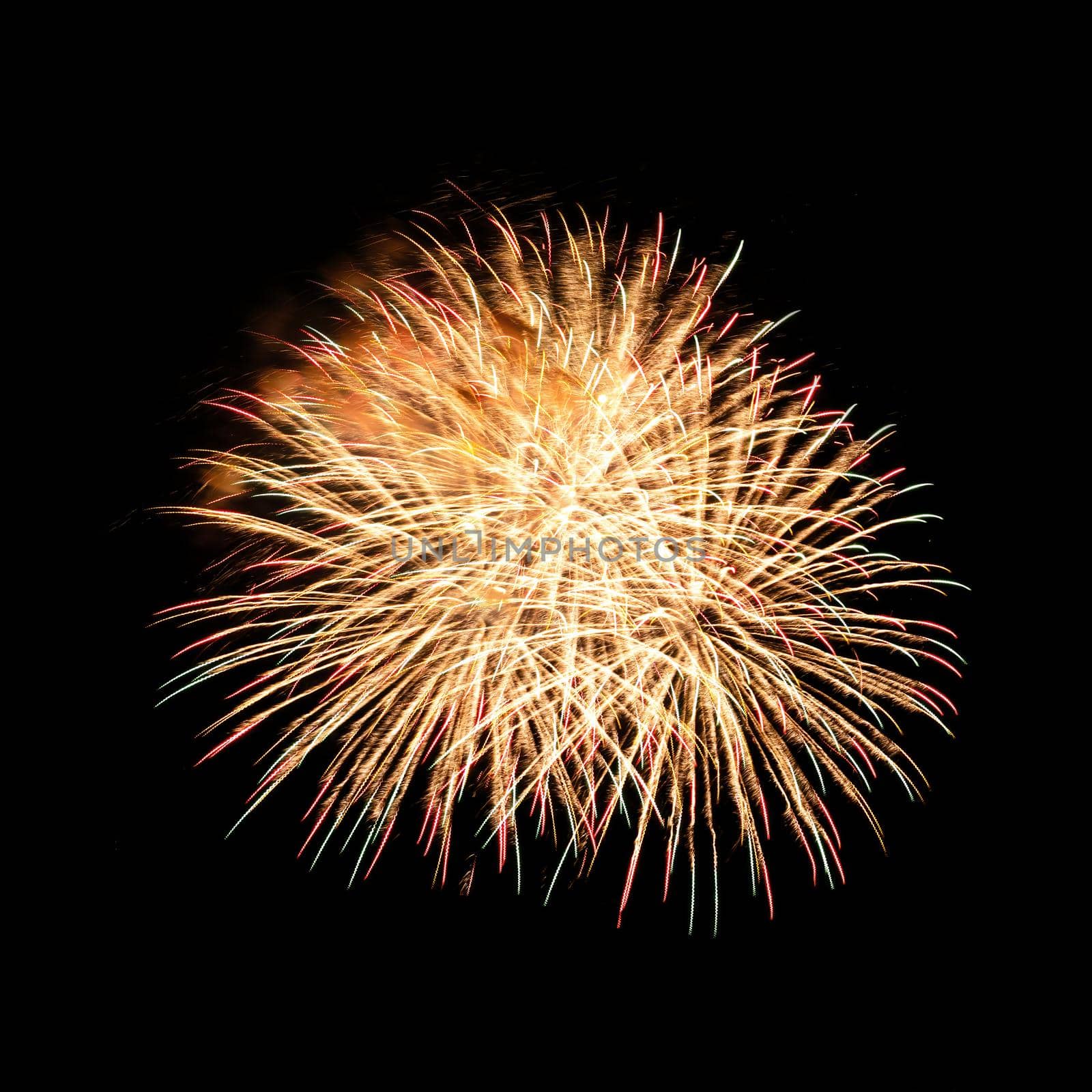 Colorful celebration fireworks isolated on a black sky background.