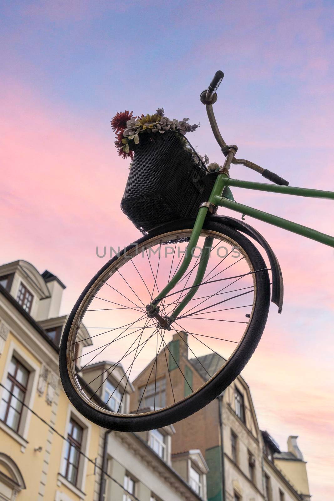 Riga, Latvia. August 2021. view of the bicycle suspended in the air in a street in the city center