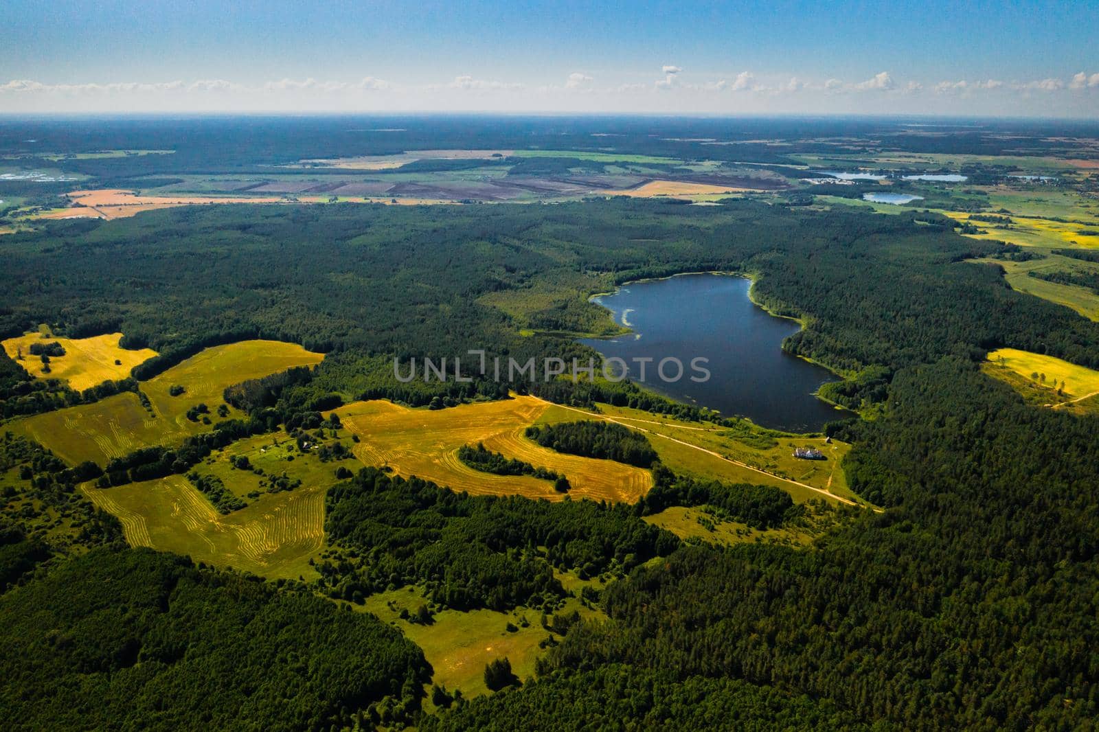 Top view of Bolta lake in the forest in the Braslav lakes National Park at dawn, the most beautiful places in Belarus.An island in the lake.Belarus