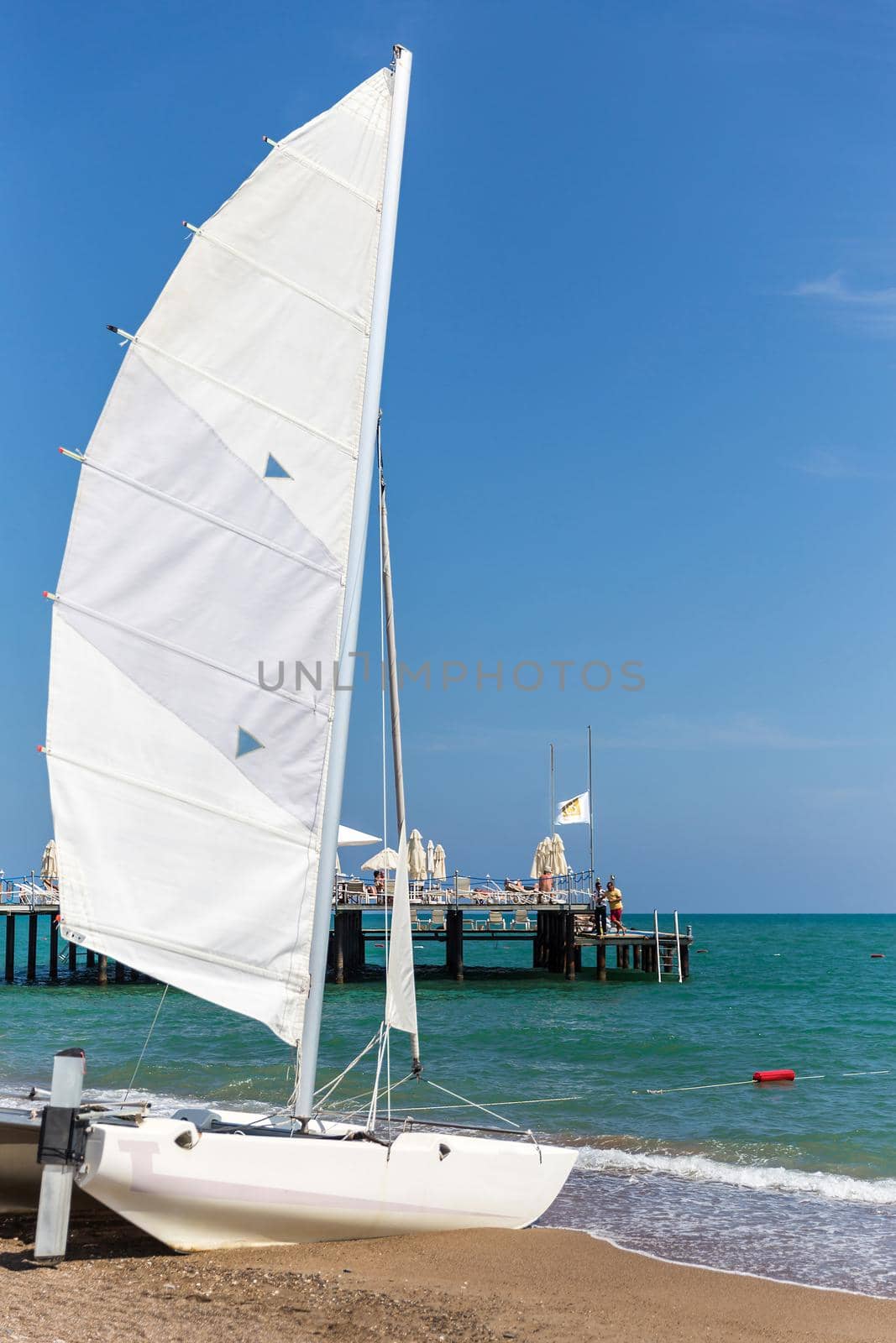 A sunny, breezy sea is perfect for a catamaran sail