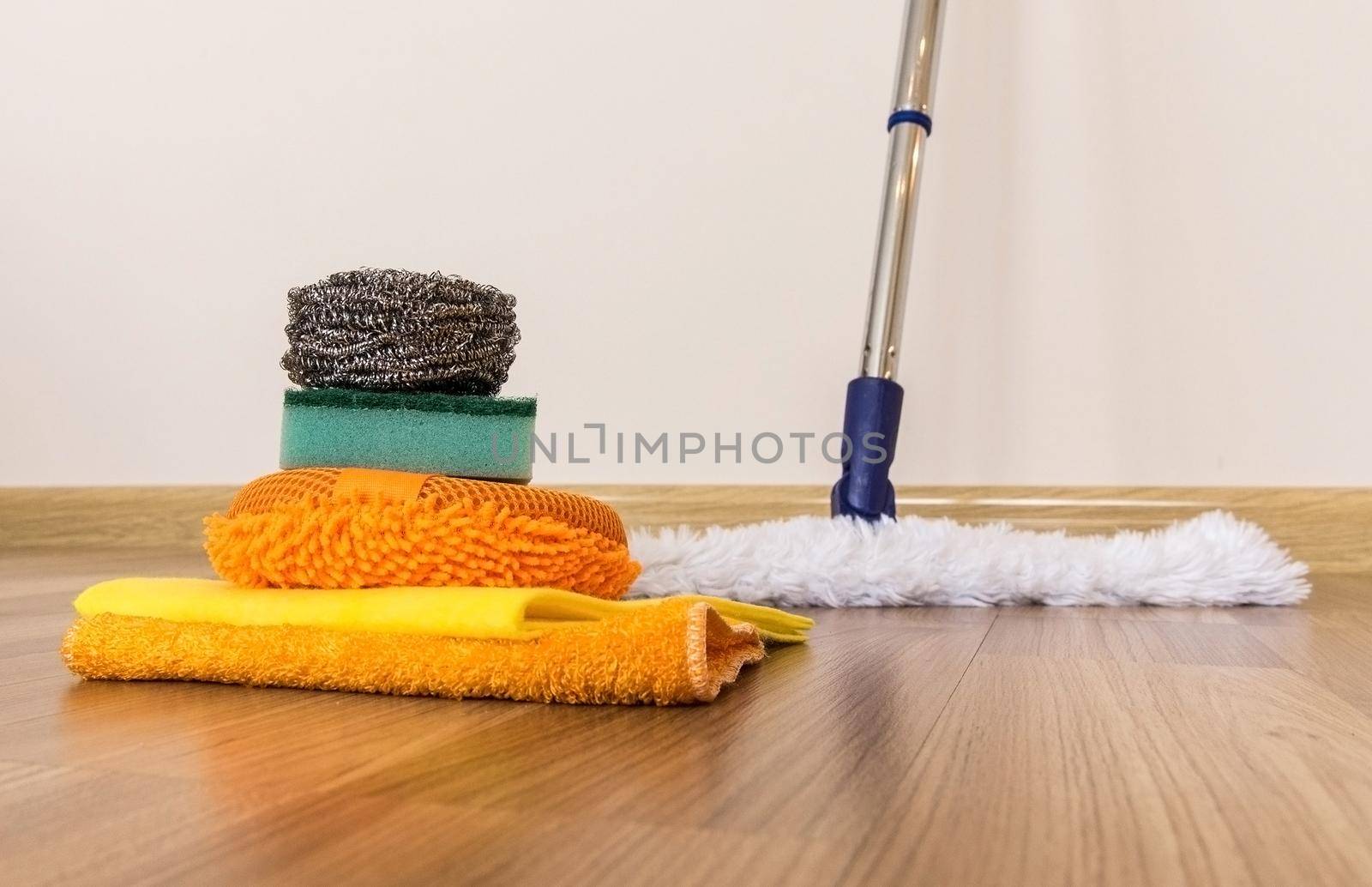 Set of cleaning equipment on a wooden floor