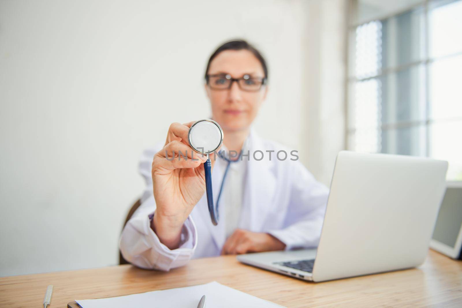 Medical Doctor is Examining Patient Health With Stethoscope in Hospital Examination Room, Female Physician Doctor is Diagnosing Physical Health Check Up for Patients. Medicine/Healthcare Concept by MahaHeang245789