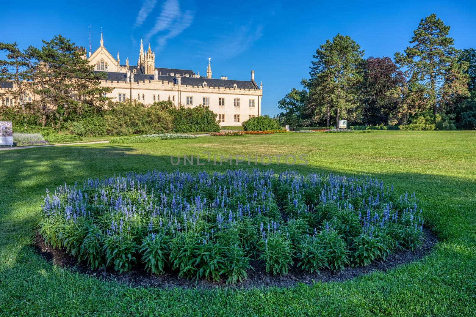 Lednice Chateau with beautiful gardens and parks on sunny summer day by artush
