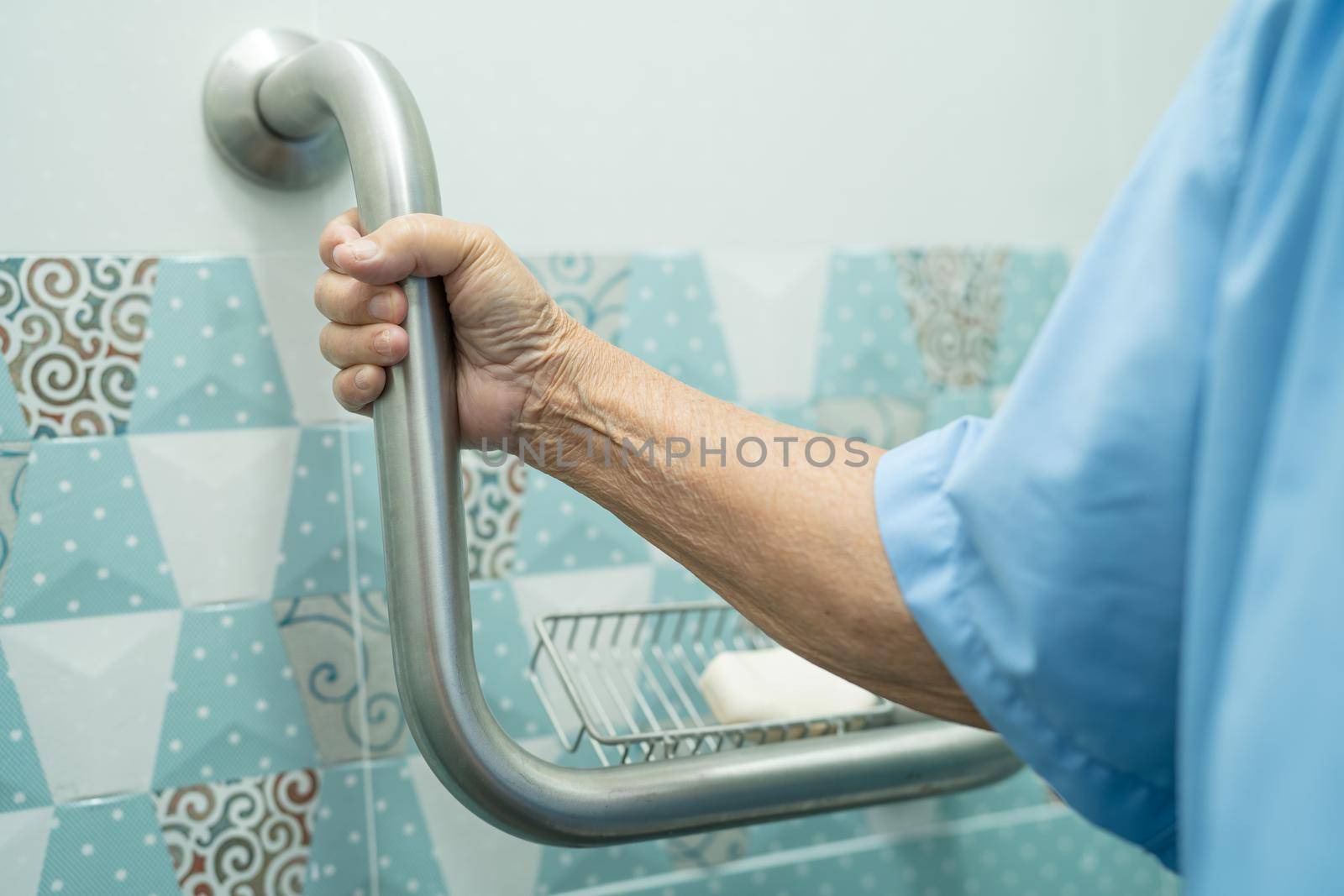 Asian senior or elderly old lady woman patient use slope walkway handle security with help support assistant in nursing hospital ward, healthy strong medical concept. by pamai