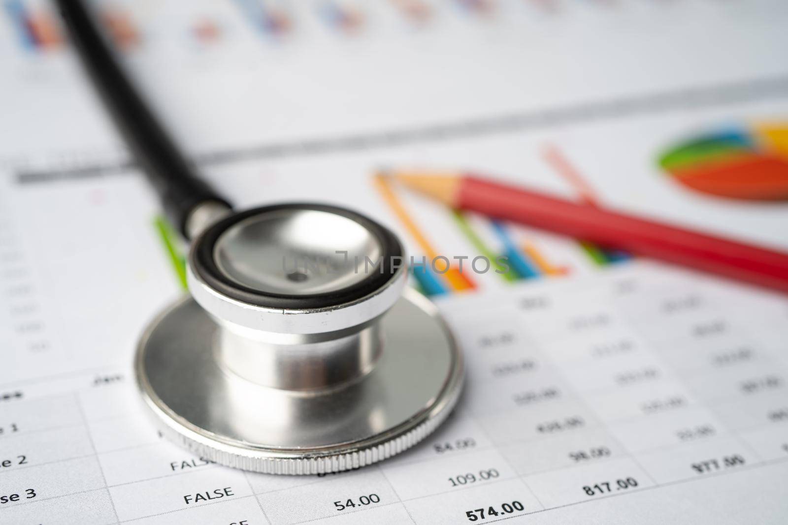 Stethoscope on charts and graphs paper, Finance, Account, Statistics, Investment, Analytic research data economy and Business company concept. by pamai