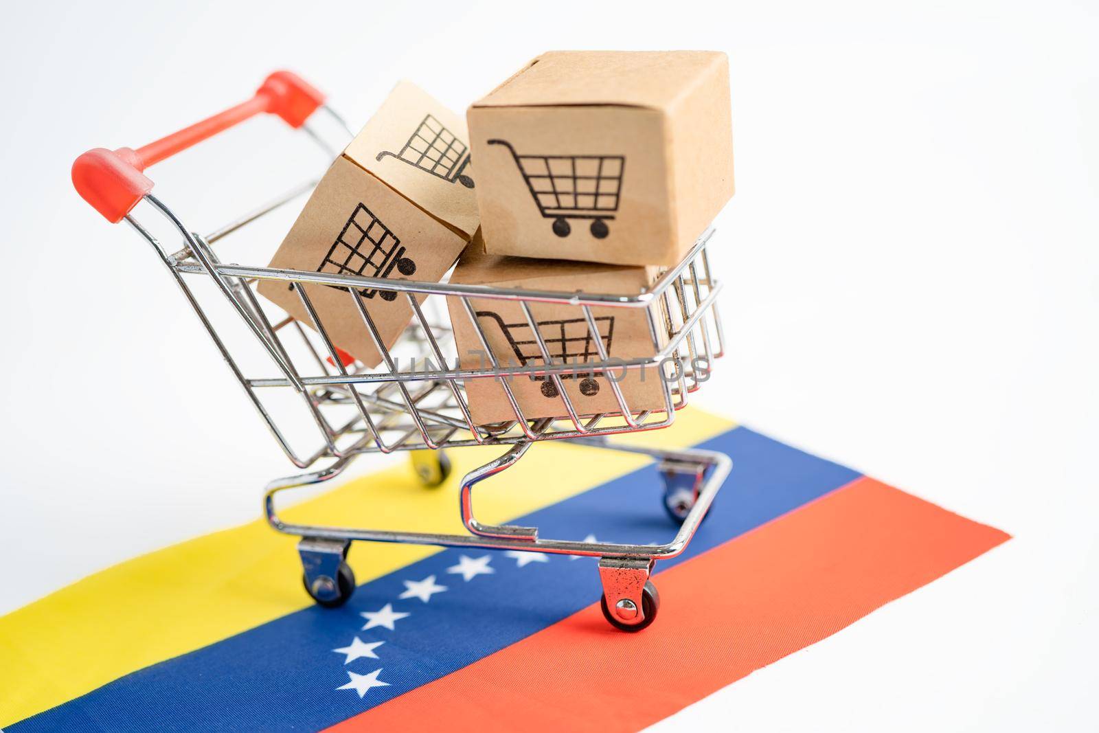 Box with shopping cart logo and venezuela flag, Import Export Shopping online or eCommerce finance delivery service store product shipping, trade, supplier concept. by pamai