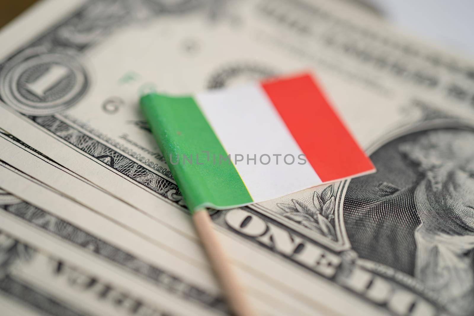 Italy flag on US America dollar banknotes money, finance concept. by pamai