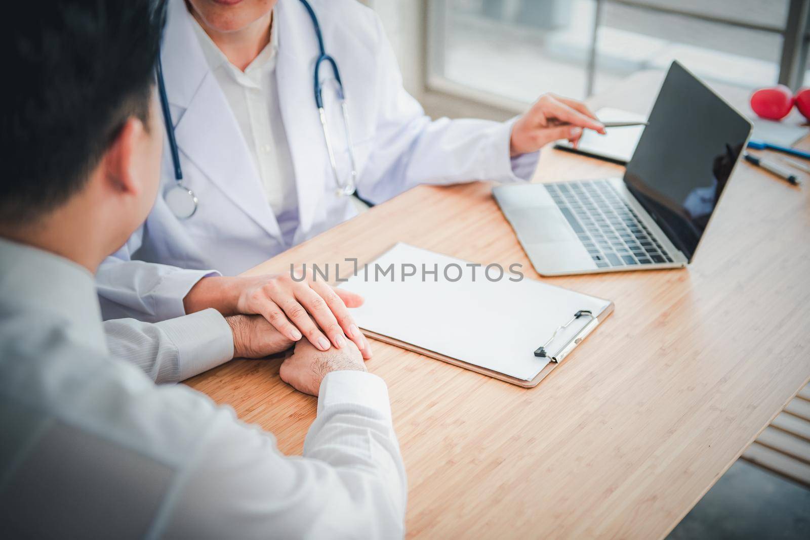 Medical Doctor is Encouraging and Health Care Consultation to Patient in Examination Room, Female Medicine Doctor Giving Encouragement and Consulting Health Problem to Male Patient. Encourage Concept