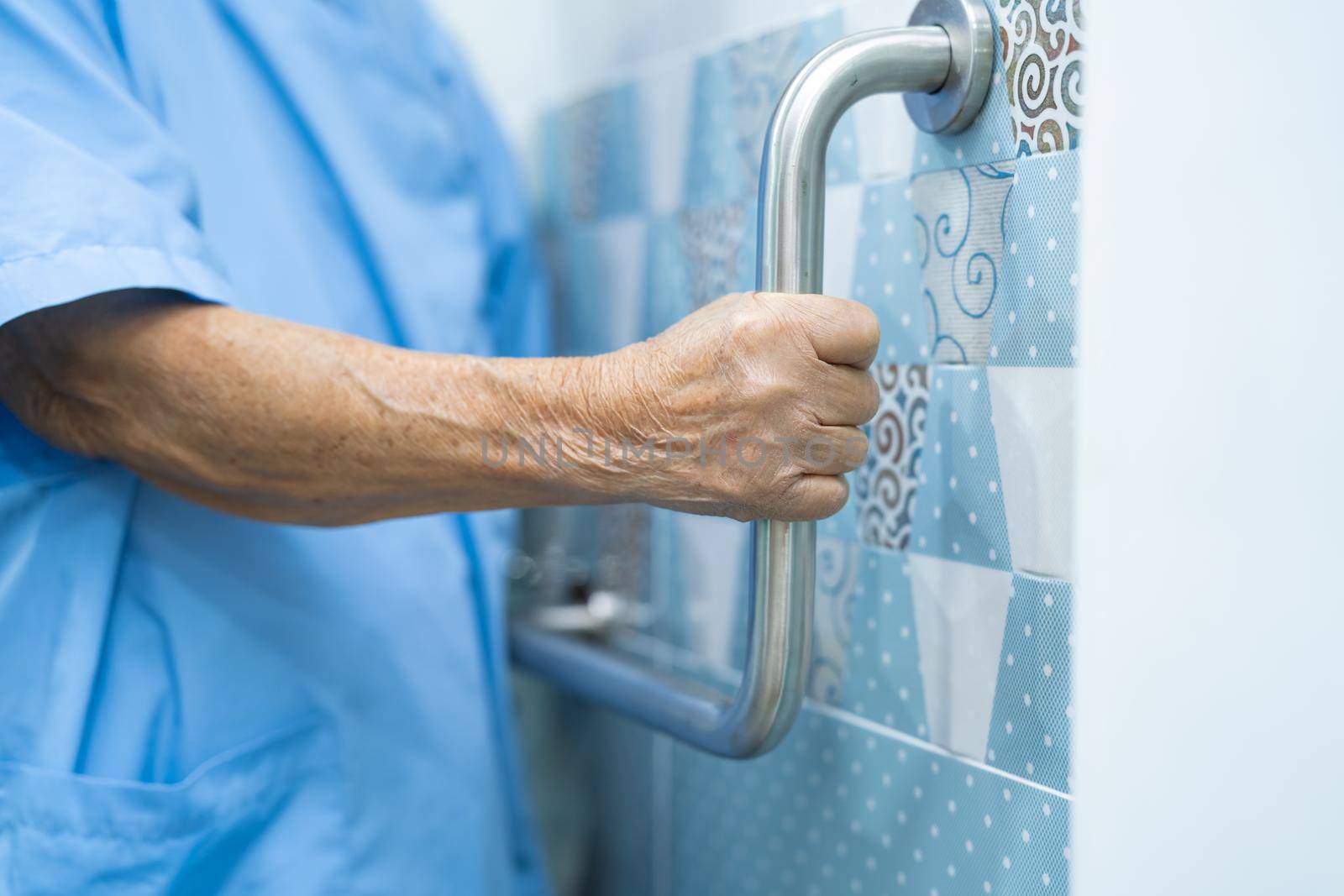 Asian senior or elderly old lady woman patient use toilet bathroom handle security in nursing hospital ward, healthy strong medical concept. by pamai