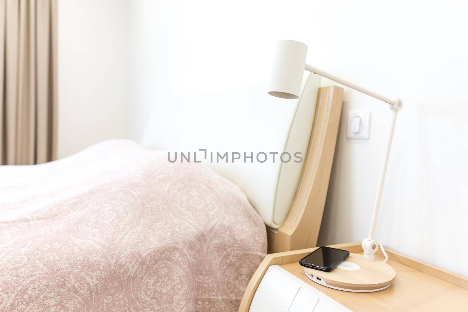 Wireless telephone charging in bedroom