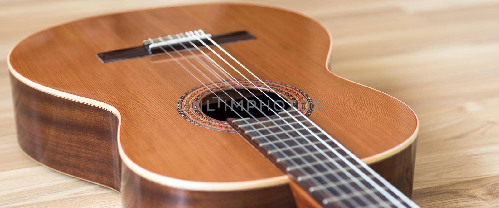 A classical guitar with six nylon strings