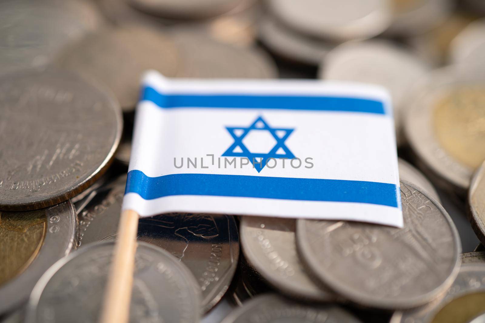 Stack of coins with Israel flag, finance concept. by pamai