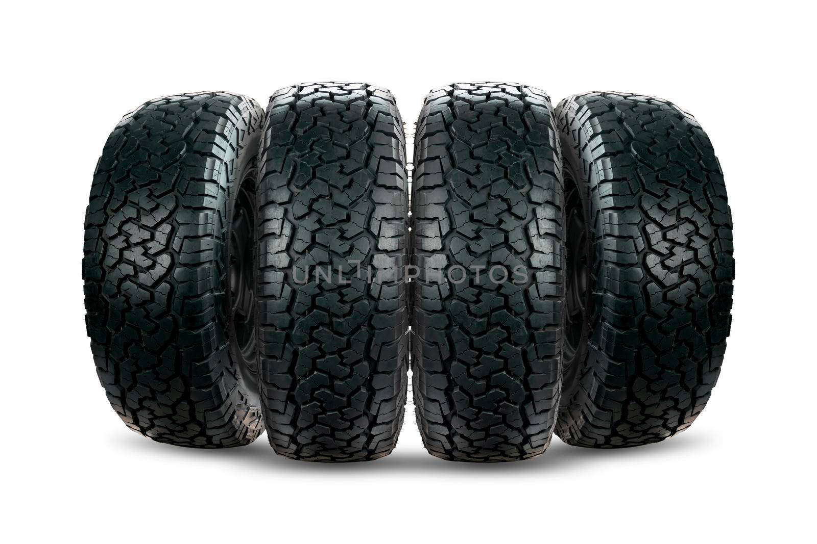 Set of 4 wheels car tires designed for use in all road conditions isolated on white background.