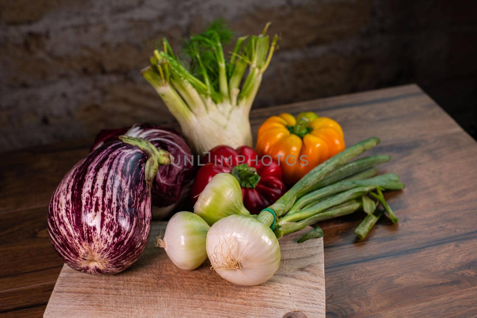 composition of vegetables with cutting board on wooden surface