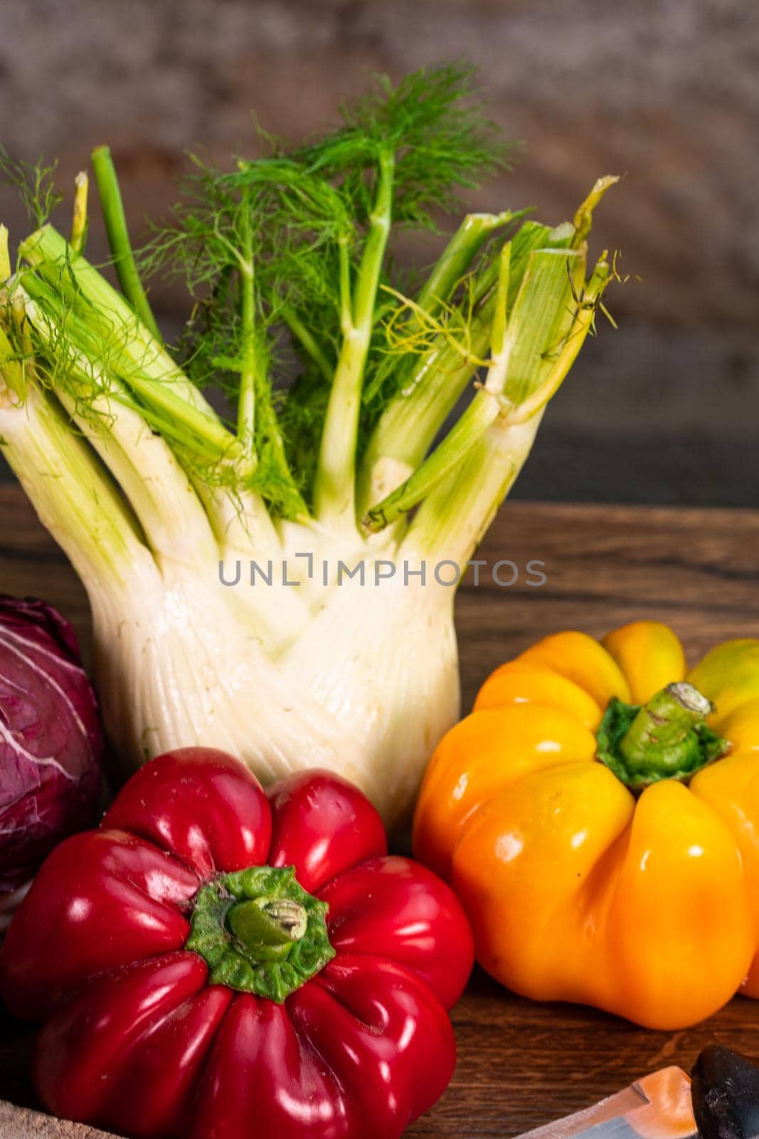 composition of vegetables with cutting board on wooden surface