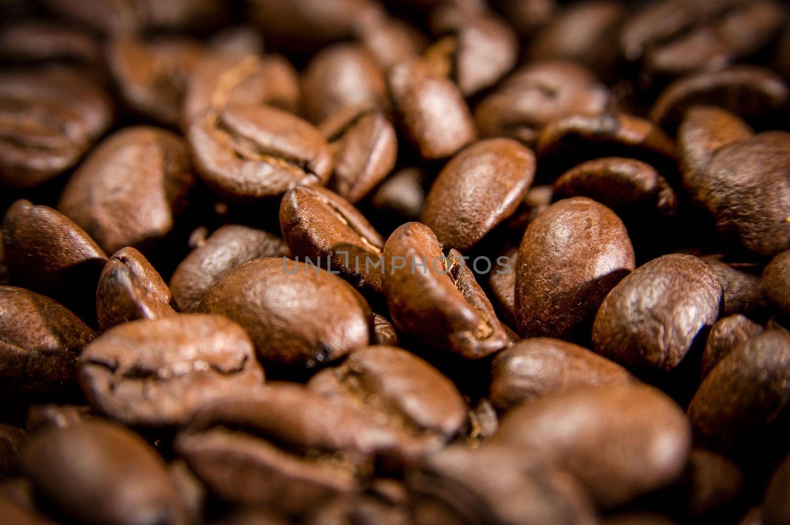 Brown coffee beans, closeup of macro coffee beans for background and texture