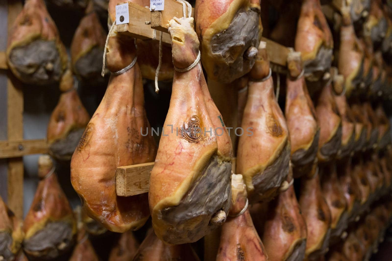 BOLOGNA, ITALY. May 02, 2018: Sorage of prosciutto in a ham factory in Bologna, Italy