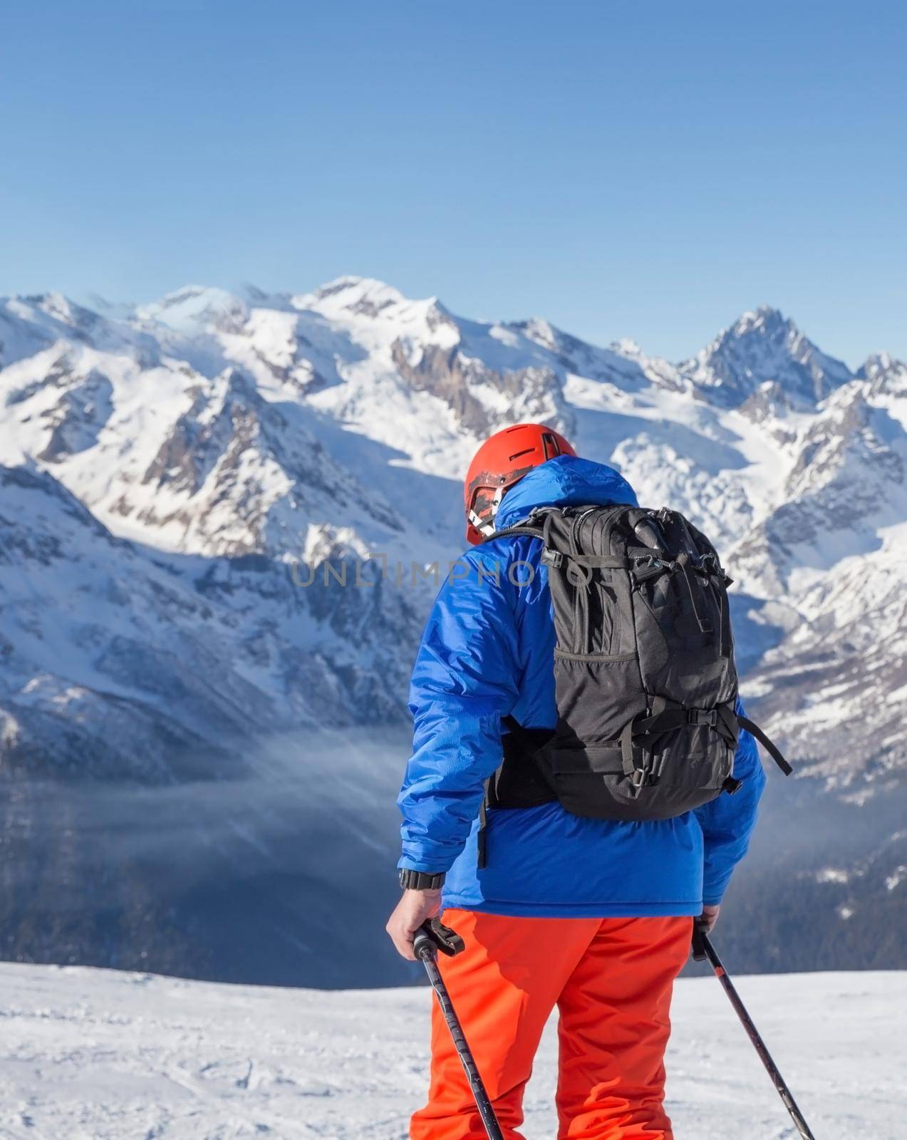 a person skiing high in the mountains