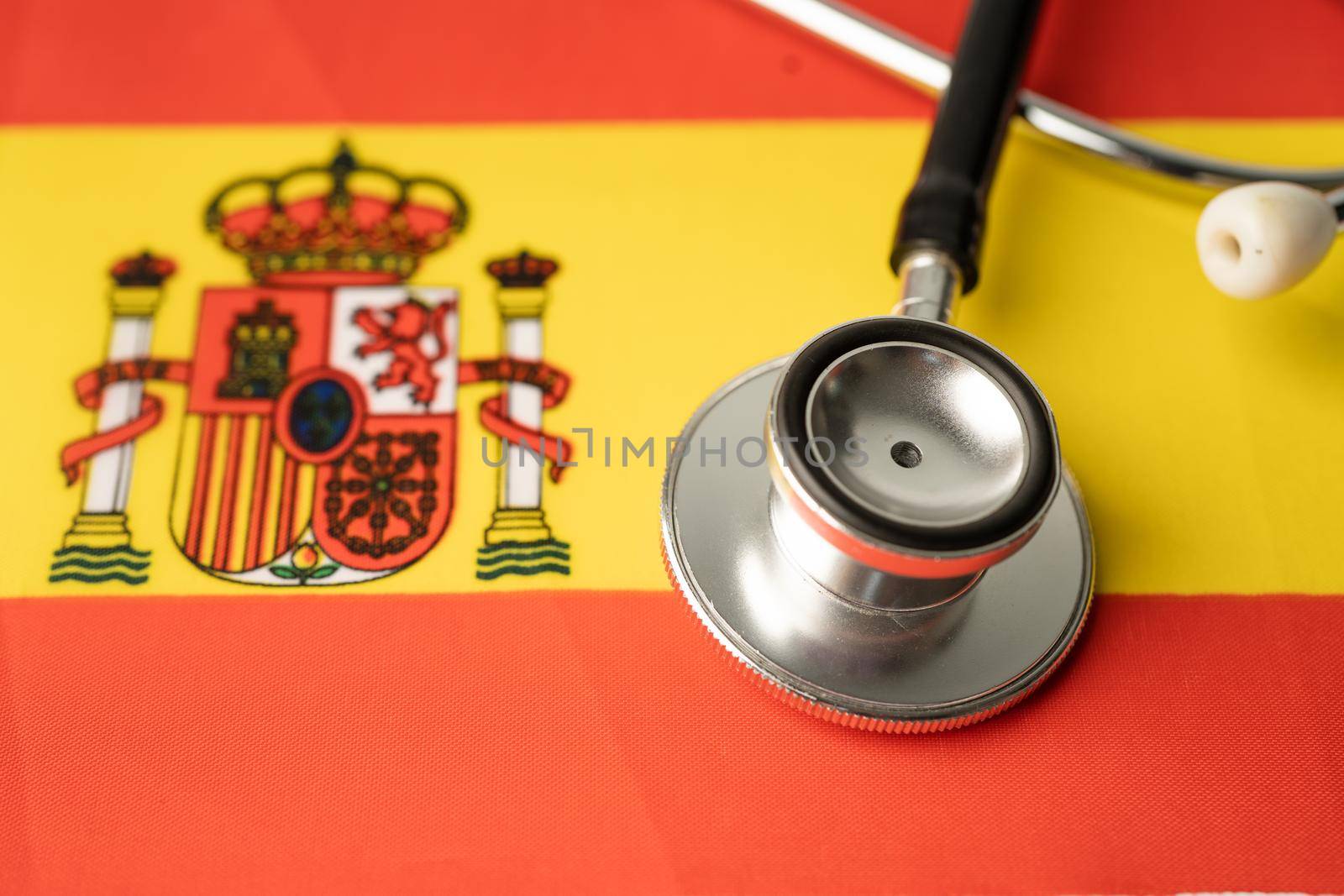 Black stethoscope on Spain flag background, Business and finance concept. by pamai