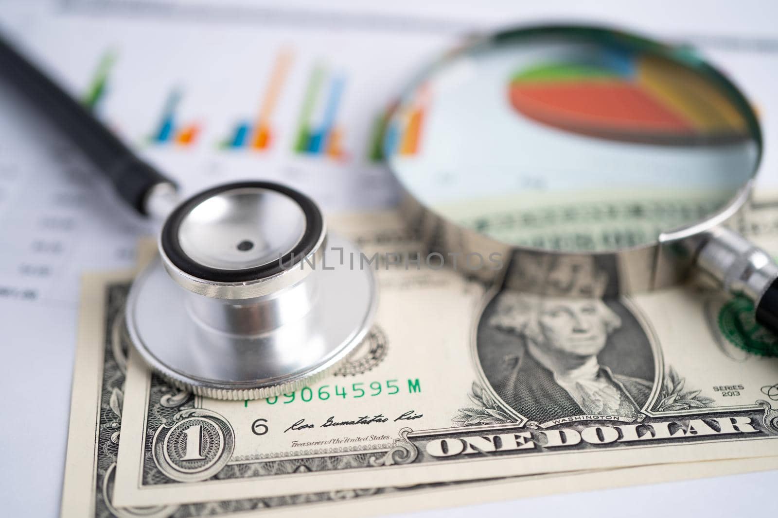 Stethoscope on chart graph paper, finance, account, statistic, analytic economy Business concept.