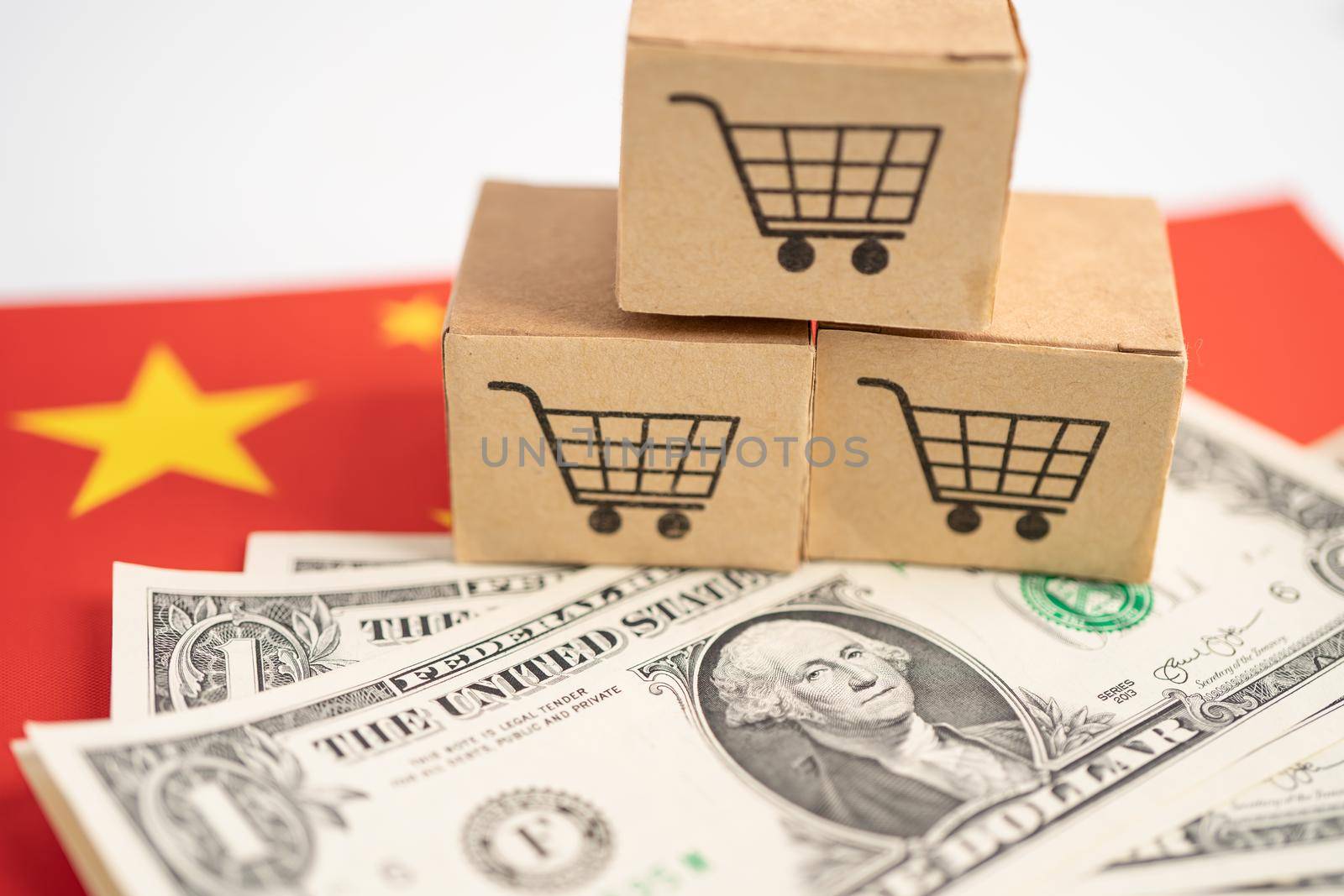 Shopping cart logo on box with US dollar banknotes on China flag; Banking Account, Investment Analytic research data economy, trading, Business import export online company concept.
