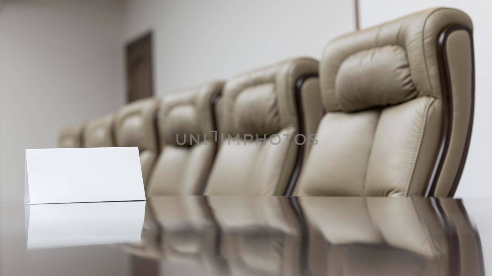 Closeup of on table in empty corporate conference room before business meeting in office