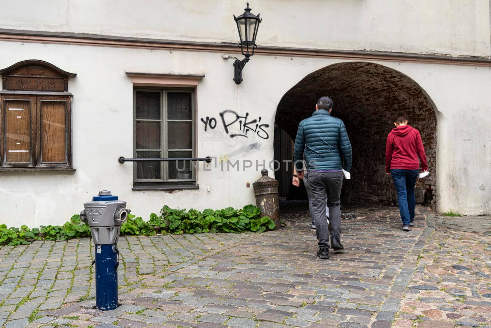 Riga, Latvia. August 2021. the passage of the alleys between the houses of the historic city center