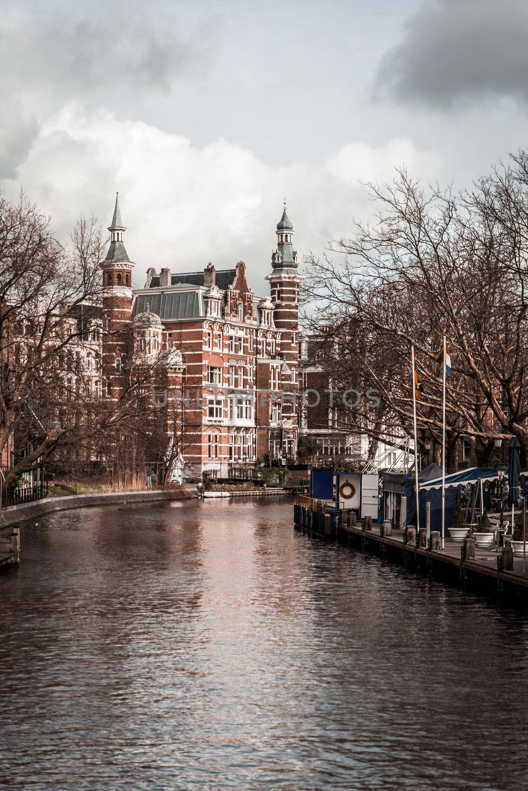 AMSTERDAM, NETHERLANDS - MARCH 15: Streets of the city with canals, on March 15, 2014 in Amsterdam