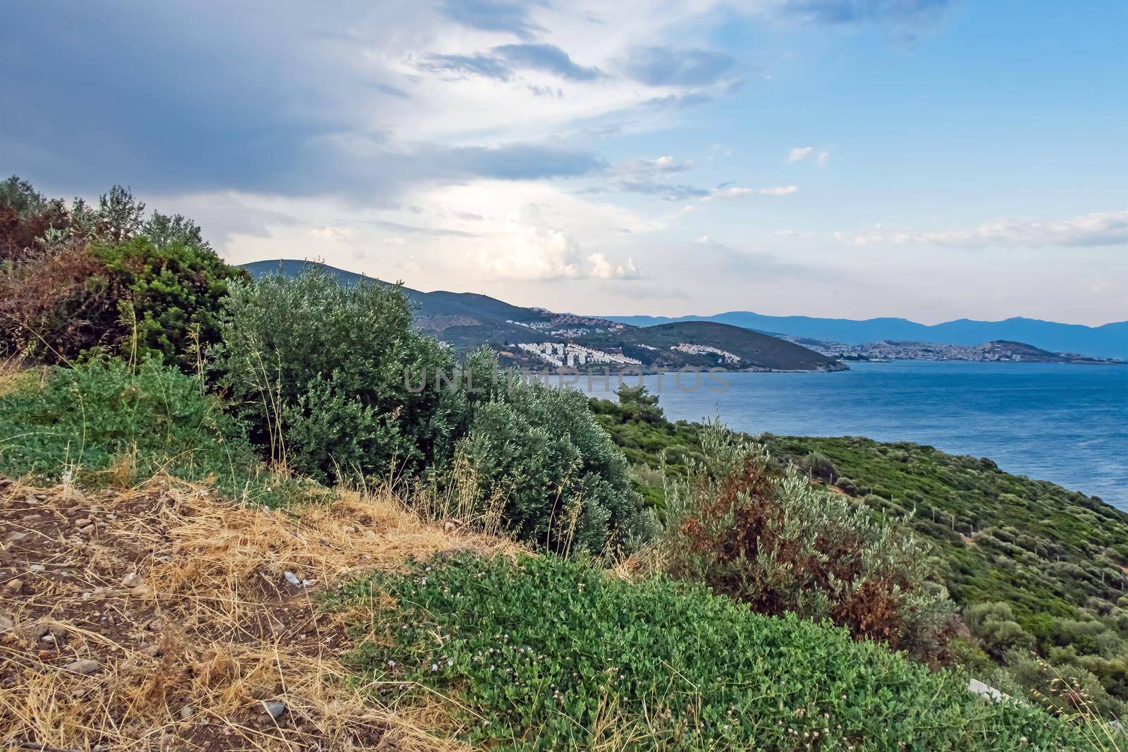 kusadasi,aydin,turkey- july 24,2021.seascape, green nature and sportive trekking paths in kusadasi in early morning time and summer season.