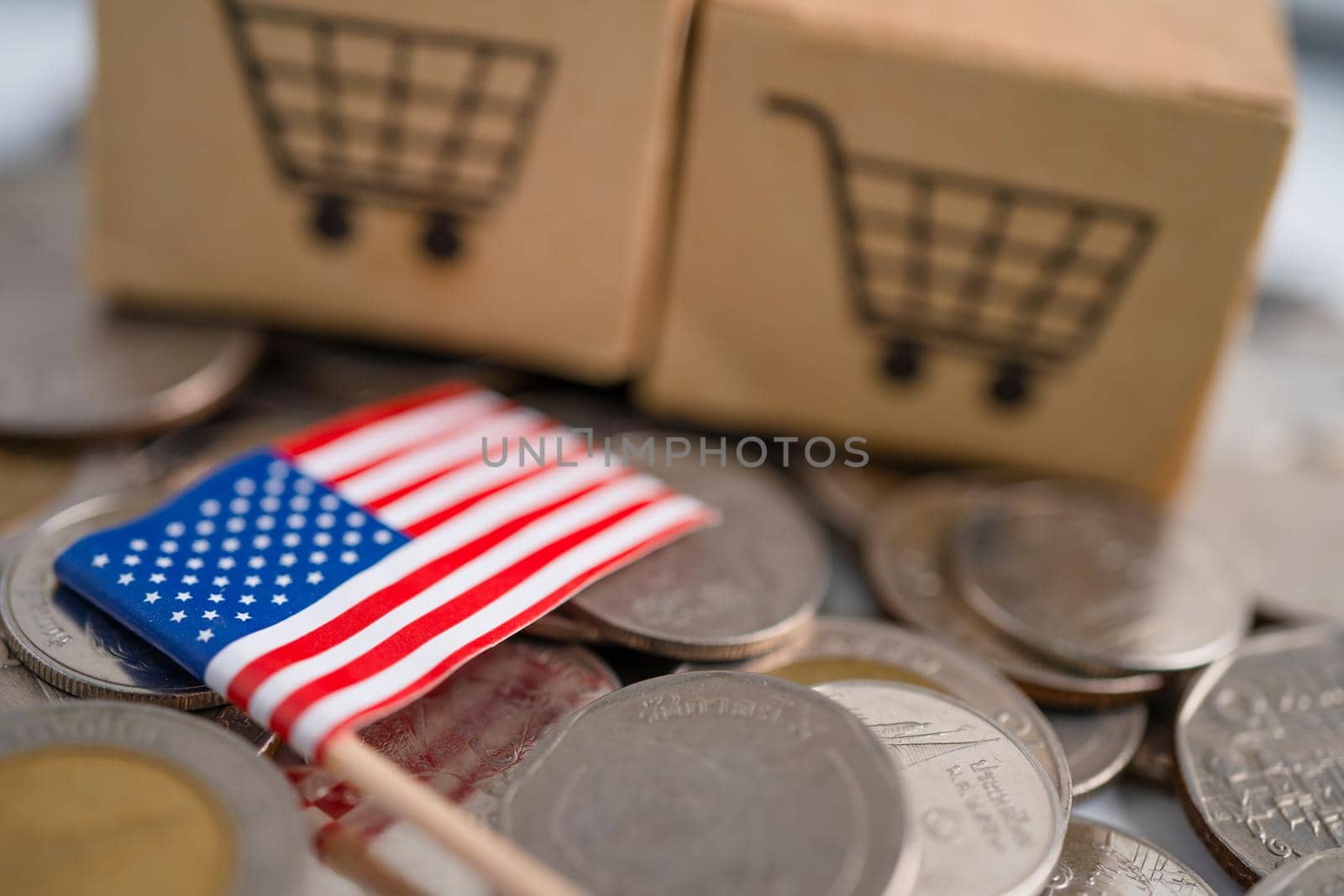 Stack of coins, shopping cart box with USA America flag, finance concept.