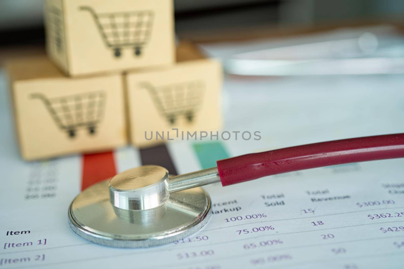 Shopping cart logo on box with magnifying glass on graph background. Banking Account, Investment Analytic research data economy, trading, Business import export transportation online company concept. by pamai