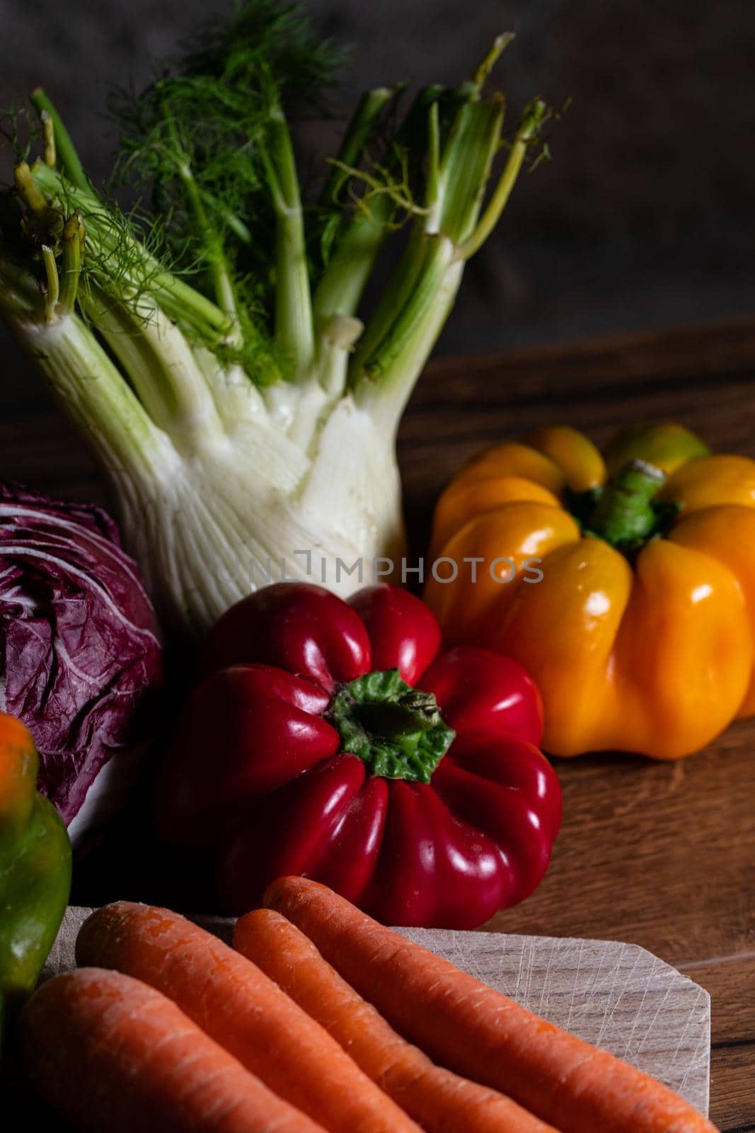 composition of vegetables with cutting board on wooden surface