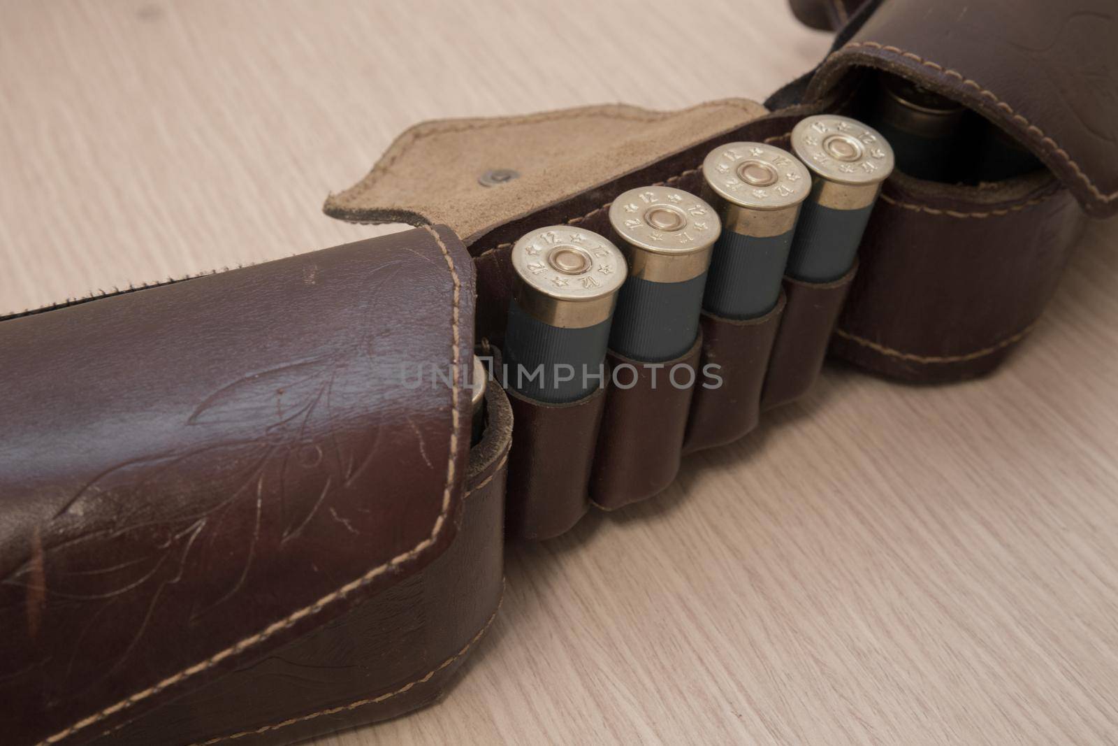 An old cartridge leather belt with shotgun shells