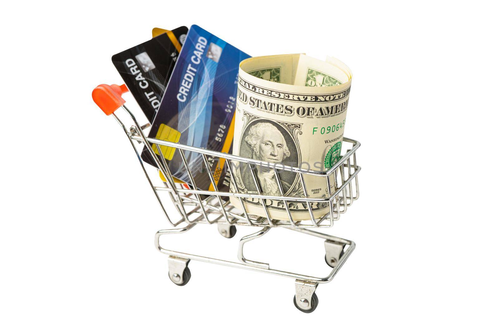 Credit card and US dollar banknotes in shopping cart isolated on white background, finance concept.