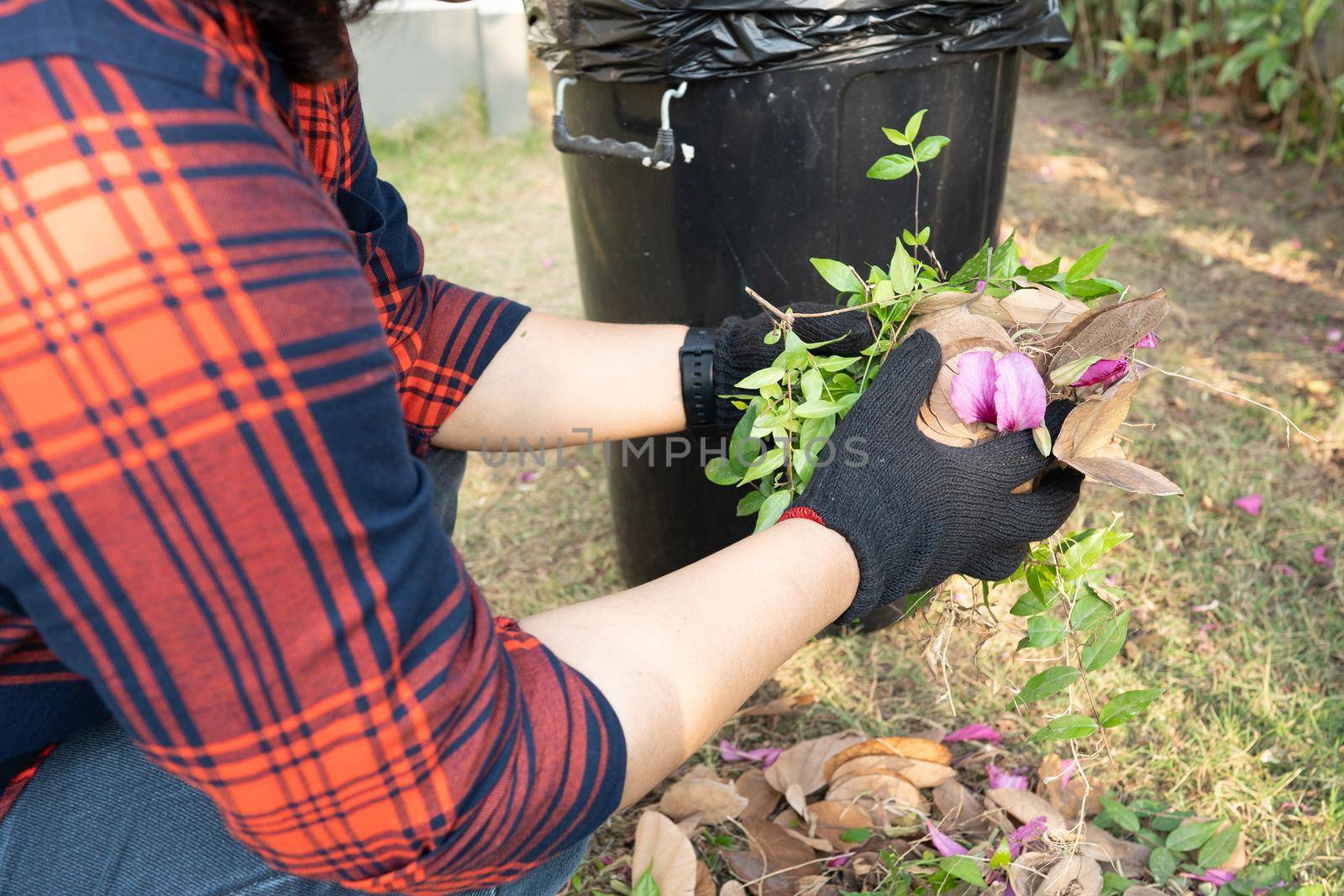 Asian woman clean and collecting bin dry leaves garbage in park, recycle, environment protection. Team with recycle project outside. by pamai