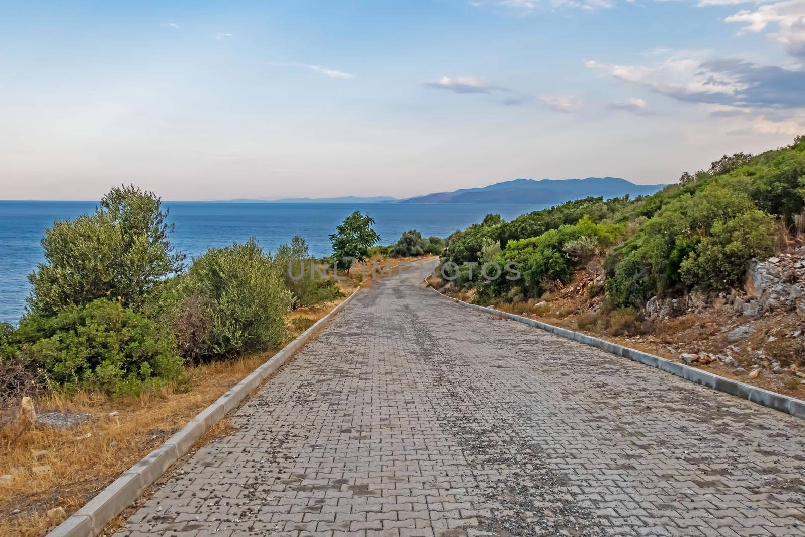 kusadasi,aydin,turkey- july 24,2021.seascape, green nature and sportive trekking paths in kusadasi in early morning time and summer season.