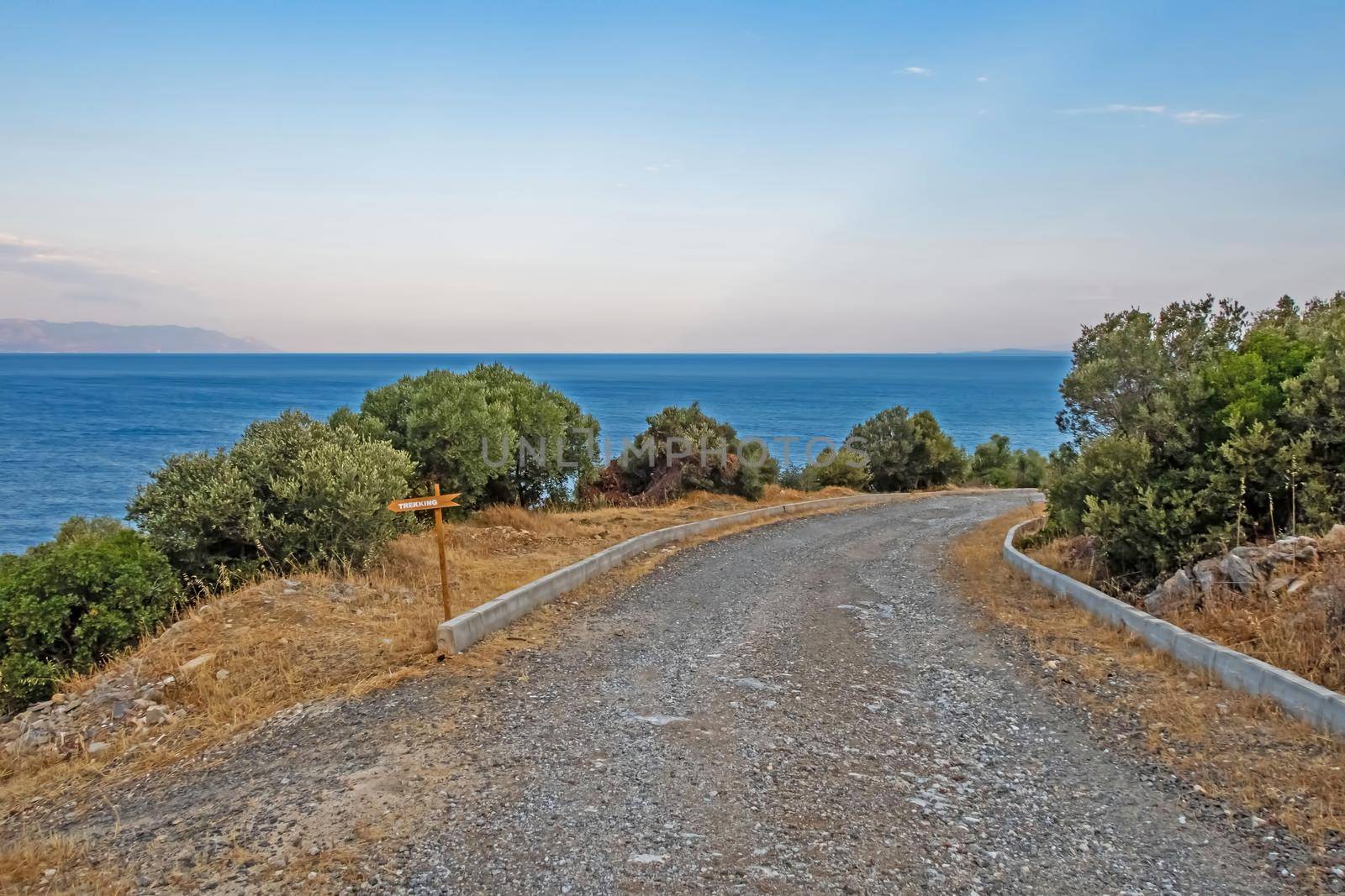 kusadasi,aydin,turkey- july 24,2021.seascape, green nature and sportive trekking paths in kusadasi in early morning time and summer season.
