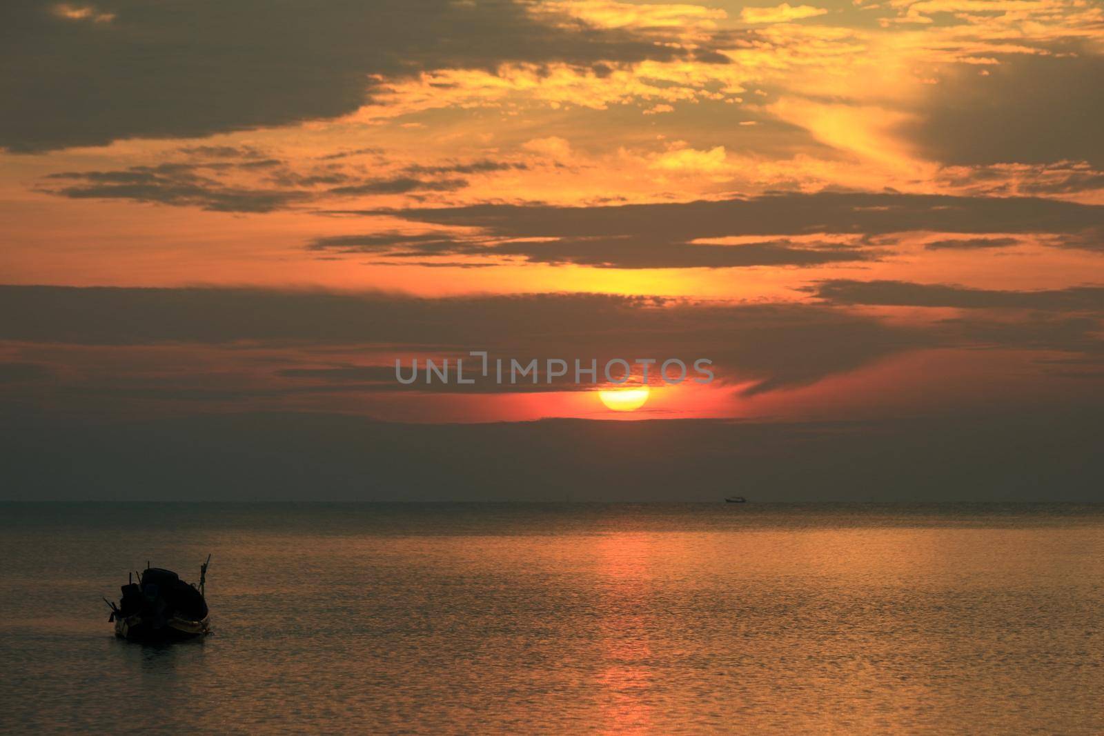 Boat silhouette, early morning, different perspectives, near and far