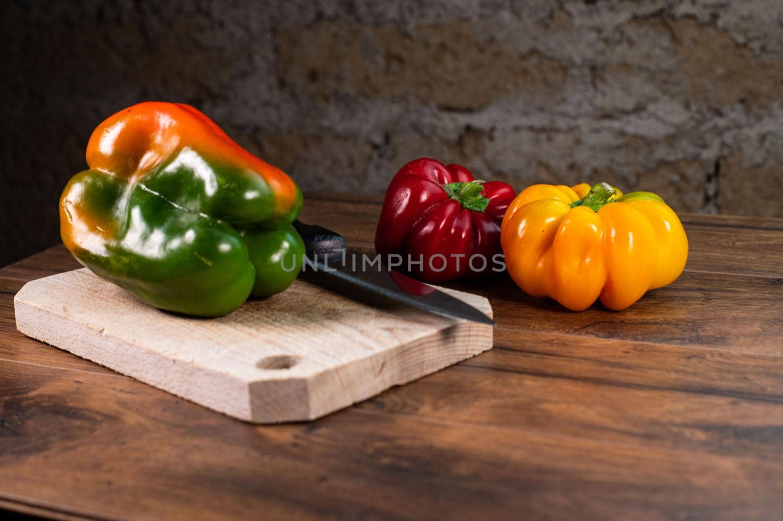 composition of vegetables with bark and cutting board on a wooden surface