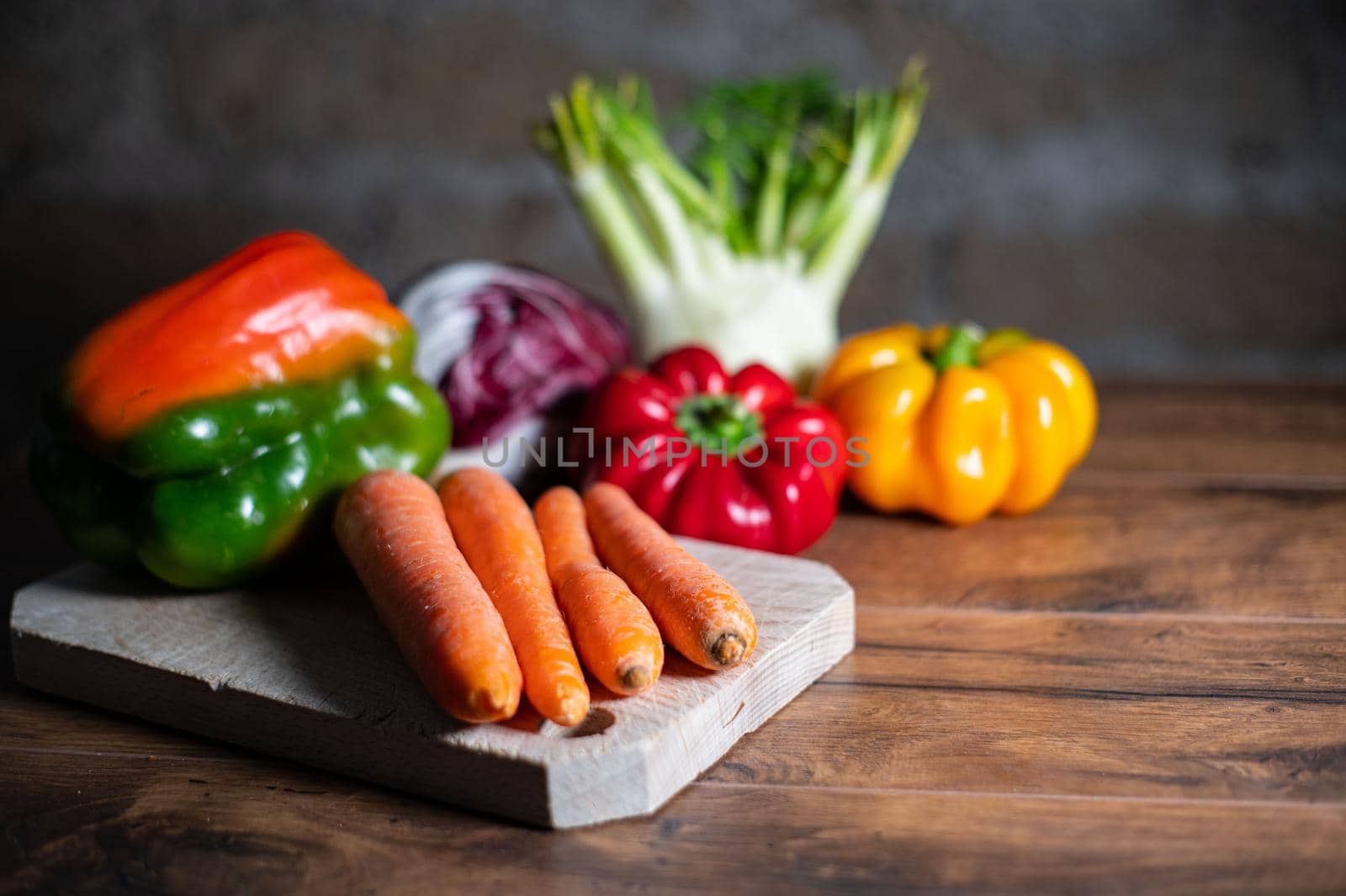 composition of vegetables with cutting board on wooden surface