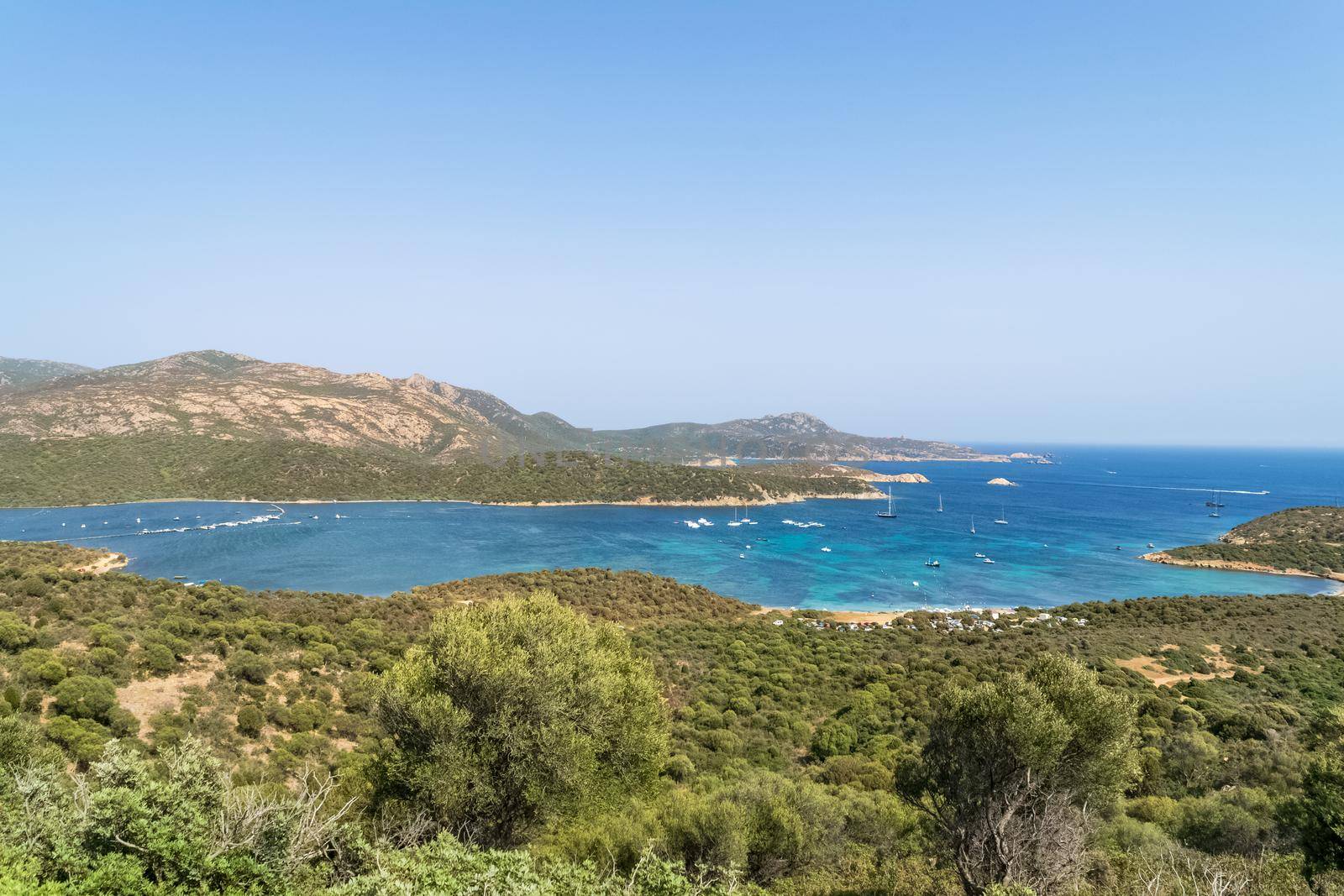 Panoramic view of the wonderful southern Sardinian coast, Teulada, Italy. Note the beautiful turquoise colors of the sea in contrast with the colors of the rocks and vegetation.