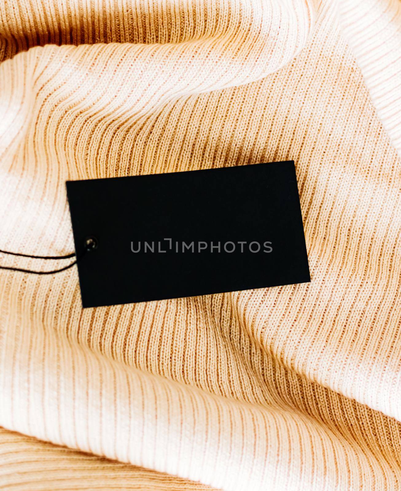 Blank black clothing tag for luxury clothing brand.