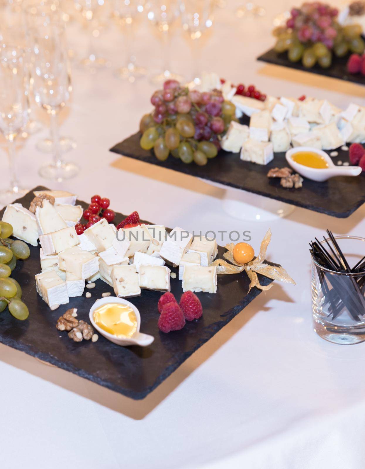 Buffet table with brie cheese and grapes