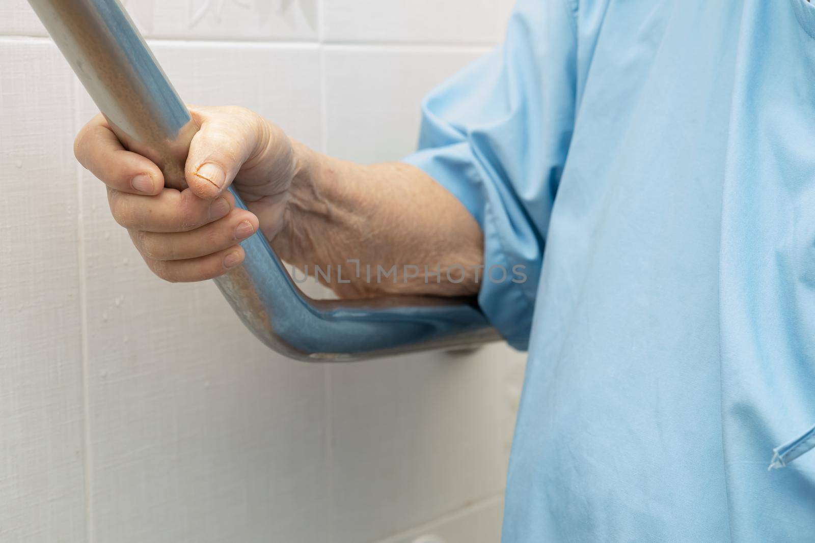 Asian senior or elderly old lady woman patient use toilet bathroom handle security in nursing hospital ward, healthy strong medical concept.