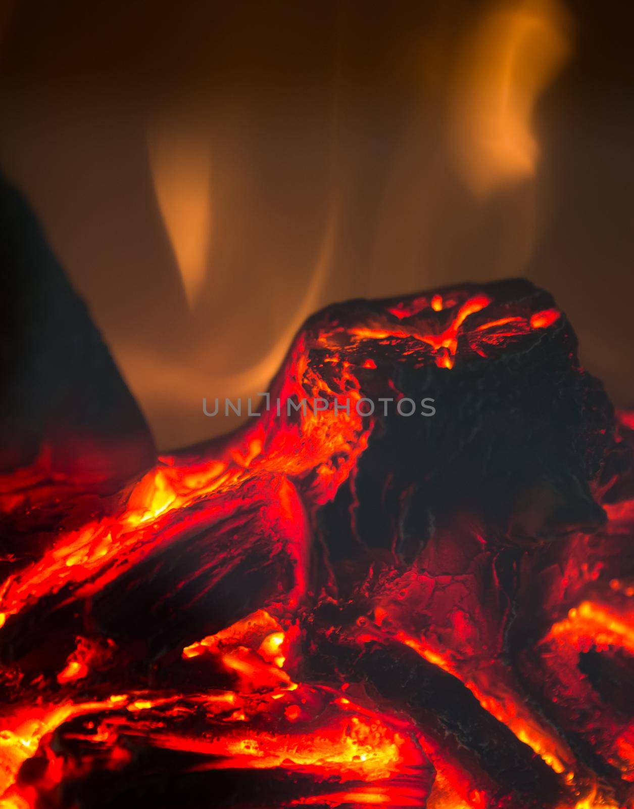 burning wood with flames of an artificial fireplace