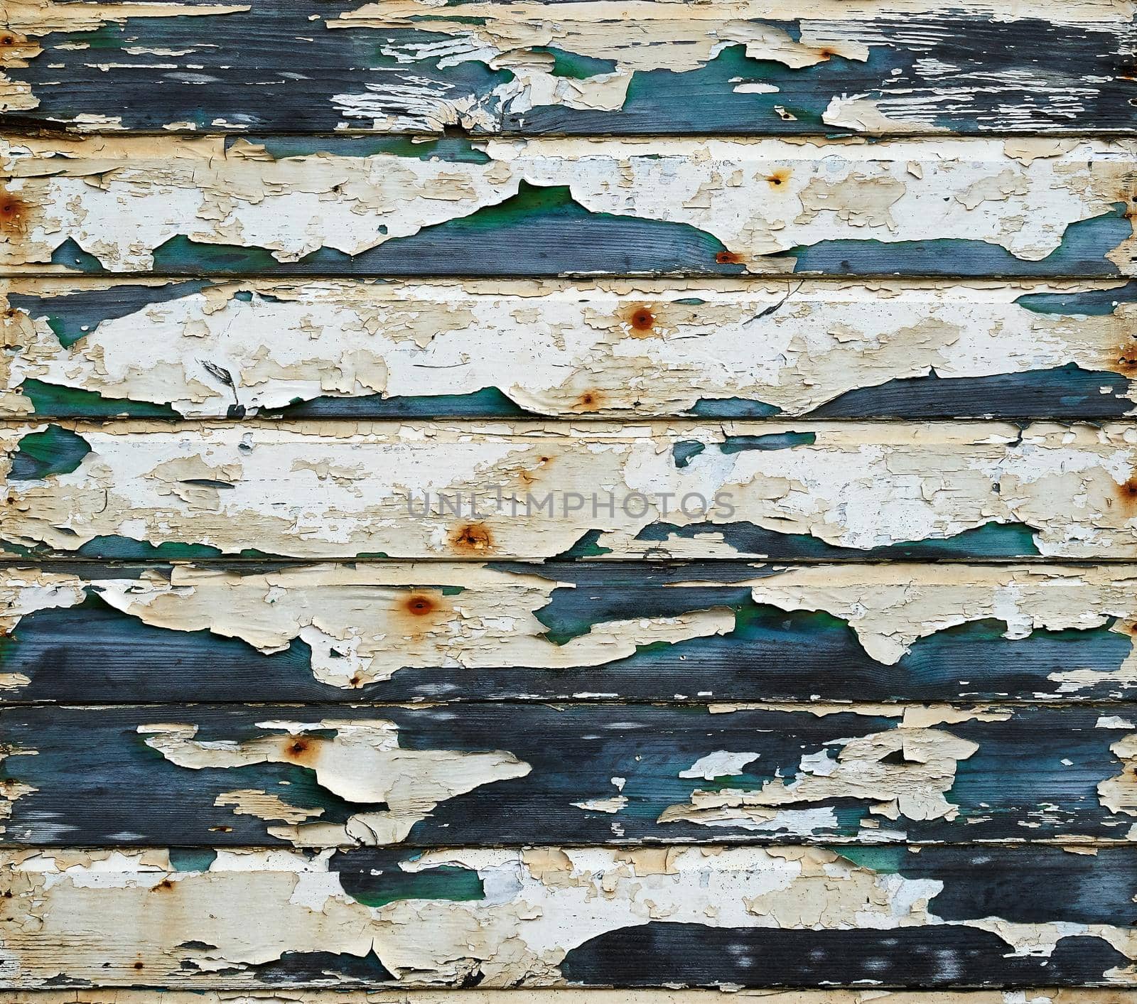 Wooden panels with peeling and worn paint