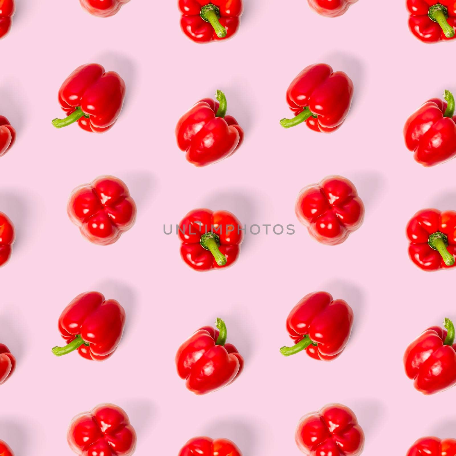 seamless pattern of bulgarian red pepper on pink background. paprika wallpaper, sweet pepper print pattern, top view, flat layout, isolated.