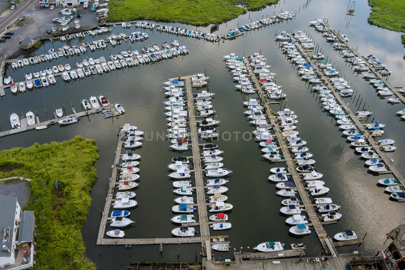 Aerial view panorama wood platform for boat in the ocean little pier marina by ungvar