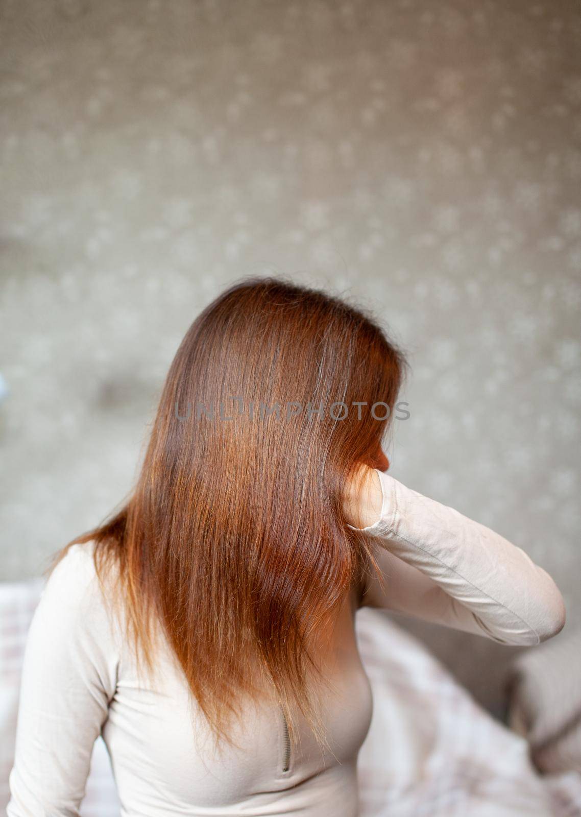A girl with long, straight and beautiful brown hair. Hair care at home by AnatoliiFoto